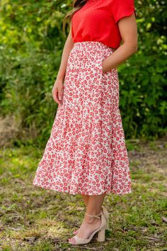 We cannot get over how stylish this skirt is! The beautiful floral print and tiered style fit makes such a cute, elegant look! Wear this skirt to any event and you are sure to receive compliments! We love tucking a blouse into this for a more elevated look or a basic or graphic tee for a casual feel! Self: 100% PolyesterLining: 100% Rayon Hand wash cold. Do not bleach. Lay flat to dry. Low iron if necessary. Kimono Blouse, Tiered Midi Skirt, Romper And Jacket, Guest Attire, Wedding Attire Guest, Long Sleeve Short Dress, Loungewear Sets, Low Iron, Long Sleeve Midi Dress