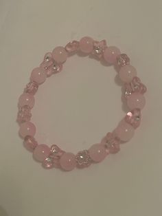 A cute simple beaded bracelet with marble pink beads and different translucent pink spacers Marble Beads Bracelet, Adjustable Pink Beaded Bracelets With 8mm Beads, Trendy Pink Bracelet With Faceted Beads, Trendy Pink Stretch Bracelet With Faceted Beads, Pink Beaded Rosary Bracelet, Pink Adjustable Crystal Bracelet With Round Beads, Pink Beaded Rosary Bracelet With Round Beads, Adjustable Pink Crystal Bracelet With Faceted Beads, Adjustable Pink Charm Bracelet With 8mm Beads