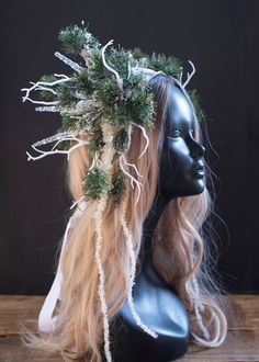 Unleash the enchantment of winter with our Icicle Headdress, a captivating accessory designed to infuse your look with a touch of snow-kissed magic. Crafted with 9" long faux iced pine branches, flocked evergreen branches, and an array of acrylic icicles and ice falls, this headdress captures the essence of a winter forest. The addition of faux snow and German glass glitter provides a dazzling sparkle, while the birch tree bark and printed ribbon introduce texture and dimension, creating a truly unique snowflake headpiece. Perfect for snow queen, ice queen, or snow fairy costumes, this whimsical headdress radiates elegance and charm. Elevate your winter ensemble for special occasions such as winter solstice festivals, Yule celebrations, winter weddings, or hand fasting ceremonies. Designed Frost Fairy Costume, Yule Costume, Snowflake Headpiece, Snow Fairy Costume, Winter Fairy Costume, Snow Spirit, Winter Fae, Snowflake Crown, Solstice Winter