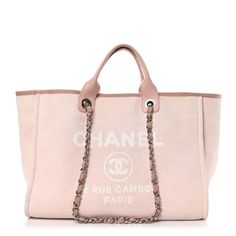 This is an authentic CHANEL Mixed Fibers Calfskin Medium Deauville Tote in Pink. This stylish tote is crafted of fine pink canvas with a white Chanel advertisement logo on the front. The bag features pink rolled leather top handles and grosgrainfabric-threadedsilver chain link shoulder straps. The top is open toa spacious pink fabric interior with zipper and patch pockets. Designer White Bag With Canvas Lining, Designer White Bags With Canvas Lining, White Designer Bag With Canvas Lining, Shopping Bag With Embroidered Logo In Coated Canvas, Shopping Bag With Embroidered Logo And Coated Canvas, Shopping Bags With Embroidered Logo And Coated Canvas, Elegant Pink Monogram Canvas Bag, Designer Pink Coated Canvas Bag, Luxury Pink Bags With Leather Handles