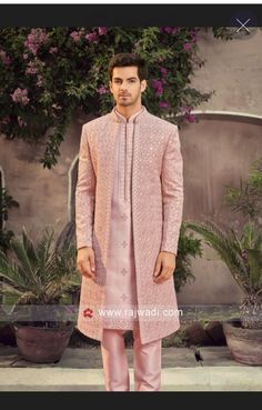 a man in a pink sherwa