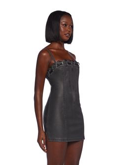 This fully lined mini dress has a matte vegan leather construction, structured boning on the front and back, side slits, a lace-up design at the neckline, adjustable shoulder straps, and a back zipper closure. Black Mini Dress With Spaghetti Straps And Strap Detailing, Fitted Black Mini Dress With Strap Detailing, Black Mini Dress With Spaghetti Straps, Black Mini Dress With Strap Detailing For Party, Black Mini Corset Dress With Lace-up Back, Date Night Mini Dress With Strap Detailing, Strap-detailed Mini Dress For Date Night, Sleek Leather Mini Dress For Club, Strap Detailed Mini Dress For Night Out