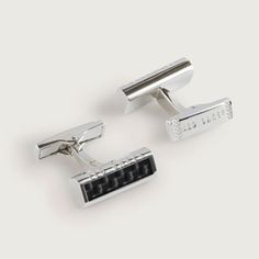 Ted Baker CARBIE Carbon Fibre Cufflinks
Add a stylish accessory to your double cuff shirt with this luxurious pair of cufflinks from Ted Baker! Perfect for finishing your outfit, these cufflinks create a smart and polished look that’s timeless and sophisticated.
These striking silver coloured cufflinks small rectangles of black carbon fibre, finished with a polished front allowing them to shimmer as they catch the light. Finished with a silver border around the edge and embossed with ‘TED BAKER’ on one side along with the link on the reverse. Modern and sharp, these cufflinks will look superb with any formal shirt ideal for any event or party.
The cufflinks come in a Ted Baker card gift box making them an ideal gift for any fashionista. Whether it’s a gift for your dad, brother, or boyfrie Sports Wedding, Double Cuff, Oil Warmer, Porcelain Signs, Advent Candles, Bottle Jewelry, Bee On Flower, Formal Shirt, Box Making