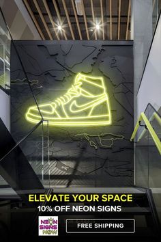 an advertisement for neon shoes is shown on the wall in front of stairs and staircases