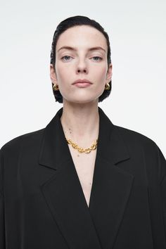 These modern hoop earrings are sculptural yet clean in design. Crafted from silver-plated recycled brass, they curve around the earlobe and have a high-shine polished finish. Bell-back closureBrass is a versatile material that can be recycled numerous times without losing any of its properties  Shell: 100% Post-consumer recycled brass. Plating: 100% Silver. Excluding trims Length: 0.70", Width: 0.51" Modern Metal Jewelry For Work, Modern Jewelry With Polished Finish For Workwear, Belted Cape, Modern Hoop Earrings, Accessories Bags Shoes, Denim Sweater, New Arrival Dress, Women Accessories Jewelry, In Design