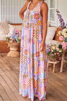 "Embrace bohemian charm with this Women's Sleeveless Floral Print Maxi Dress. Perfect for summer days, its breezy silhouette and captivating floral print capture the essence of boho chic. Effortlessly stylish and endlessly comfortable, this dress is a must-have for your warm-weather wardrobe." Summer Dresses With Colorful Pattern, Colorful Pattern Sleeveless Dress For Vacation, Spring Patchwork Dresses With Spaghetti Straps, Summer Vacation Sundress With Patchwork, Sleeveless Summer Maxi Dress With Colorful Pattern, Spring Vacation Dress With Patchwork, Flowy Floral Patchwork Summer Dresses, Casual Patchwork Sleeveless Dress For The Beach, Patchwork Dress For Spring Vacation