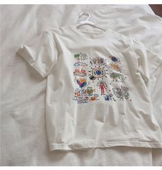 Name: color graffiti, white large size top, loose tide T-shirt short sleeve topMaterial:cottonColor:whiteFeatures:color graffitiSize(cm) :M,L,XL,2XL 1inch=2.54cmM:shoulder:46,bust:94,sleeve:20,length:60,Recommended weight:42kg-49kgL:shoulder:48,bust:98,sleeve:21,length:62,Recommended weight:50kg-56kg&ltp&gtXL:shoulder:50,bust:102,sleeve:22,length:64,Recommended weight:561kg-62kg</p>&ltbr/>&ltp&gt2XL:shoulder:52,bust:106,sleeve:23,length:66,Recommended weight:62kg-69k White Cartoon Print T-shirt For Spring, Trendy White T-shirt With Cartoon Print, White Casual T-shirt With Cartoon Print, Casual White T-shirt With Cartoon Print, White Short Sleeve T-shirt With Cartoon Print, White T-shirt With Cartoon Print For Spring, Trendy White Tops With Graffiti Print, Trendy White Top With Graffiti Print, Artsy White Short Sleeve T-shirt