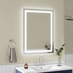 a bathroom with a sink, mirror and towel rack on the wall next to it