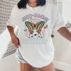 "You will love this really cute Bella Canvas 3001 soft tshirt that has bright colors and reads \"Antisocial Butterfly\". This tshirt is perfect for either yourself or that antisocial that hates being around people. This is the perfect gift idea for your gf, bestie, mom, etc. I can assure you that introvert will love this really cute butterfly tshirt! *Please note that the colors/design may vary depending on the screen being viewed on! *Tshirt Specs- Bella Canva 3001 unisex tshirt: *UNISEX SIZE G Cute Butterfly Print T-shirt For Spring, Casual Pink T-shirt With Butterfly Print, Cute Summer T-shirt With Butterfly Print, Cute Butterfly Print T-shirt For Summer, Cute Butterfly Print Summer T-shirt, Cute Spring Butterfly Print T-shirt, Trendy White T-shirt With Butterfly Print, White Butterfly T-shirt For Summer, White Butterfly T-shirt For Spring