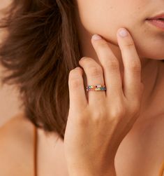 Meet our Mini Rainbow Band Ring- this whimsical piece is adorned with an arc of meticulously selected CZ stones, each shimmering with the joyous hues of the rainbow. Perfect for the color-loving daydreamer, this ring is more than an accessory—it's your very own piece of wearable joy. Adjustable Rainbow Stackable Jewelry, Adjustable Rainbow Gemstone Ring, Fine Jewelry: Multicolor Stackable Pieces, Adjustable Multi-stone Rainbow Jewelry, Multicolor Stackable Fine Jewelry, Everyday Rainbow Round Jewelry, Stackable Multicolor Jewelry, Rainbow Multi-stone Jewelry For Promise Ring, Rainbow Stackable Cubic Zirconia Rings