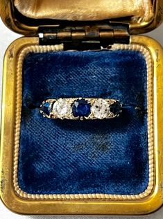 Gorgeous Victorian 18k Gold Engraved Sapphire & Diamond Ring with three oval cut natural sapphires and two old mine diamonds all set in an intricately carved gallery. The stones are beautiful and sparkling, a very fine quality and classic example of the Victorian era. It is hallmarked with the French eagle's head (for 18k gold purity).  US size: 6 3/4 (it can be resized upon request) Weight: 4.8 grams Excellent antique conditions. Thank you for visiting Boudoir Vintage!   Please feel free to contact me for further information or photos.  I offer international shipping. Your item will be packed with extreme care and will be shipped within 3-5 working days. If you are dissatisfied with your item, please feel free to contact me and would be happy to assist.  If you are interested in paying in Antique Oval Three Stone Diamond Ring, Antique Oval Sapphire Diamond Ring, Victorian Sapphire Ring With Diamond Oval Shape, Victorian Oval Sapphire Ring With Diamond, Antique Sapphire Diamond Ring With Rose Cut, Antique Oval Sapphire Ring With Single Cut Diamonds, Heirloom Sapphire Diamond Ring With Multi-stone, Antique Three-stone Round-cut Jewelry, Antique Three-stone Round Cut Jewelry