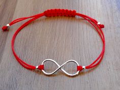 Red String Bracelet with an Infinity charm. The charm is made from a Sterling Silver .925 Adjustable size. Widest length - approx. 20 cm The item is stamped/marked .925! 100% guaranteed quality. Images are real and not processed with Photoshop. All of this can be seen in the photos. NOTE: Due to the difference device/monitors being used, pictures may not reflect the actual colour of the item. Copyright infringement is prohibited! Work only in sterling silver, not in chrome plated pewter. Do not Nickel-free Red Sterling Silver Bracelet, Red Sterling Silver Jewelry For Friendship, Red Minimalist Sterling Silver Bracelets, Infinity Charm, Red String Bracelet, Infinity Jewelry, Red String, Girl Jewelry, Handmade Jewelry Diy