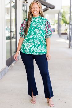 Embrace playful elegance with our Flower Festival Top in green! This eye-catching piece features a colorful floral print, accented by intricate pink embroidery on the sleeves! Fun and flirty, it's the perfect addition to your wardrobe for a touch of whimsy! 100% Polyester Embroidered Green Blouse For Fall, Casual Green Blouse With Floral Embroidery, Fitted Blouse For Spring Garden Party, Green Printed Spring Tops, Fitted Green Printed Blouse, Summer Green Floral Print Blouse, Green Floral Print Summer Blouse, Green Floral Print Blouse For Brunch, Green Floral Embroidered Tops For Fall