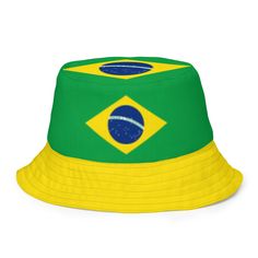 Show off your Brazilian pride with our Stylish and Reversible Brazilian Flag Bucket Hat! This versatile hat is perfect for sunny days, festivals, beach trips, or any occasion where you want to represent Brazil in style. With two looks in one, this reversible hat lets you switch up your outfit effortlessly--whether you want to rock the bold colors of the Brazilian flag or a sleek, solid design. * 100% polyester * Fabric weight: 8.1 oz/yd² (275 g/m²)  * Moisture-wicking and breathable fabric * Lin Brazilian Flag, Reversible Bucket Hat, Streetwear Accessories, Bucket Hats, Different Outfits, Beach Trip, Sunny Days, Bold Colors, Breathable Fabric