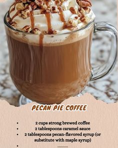 a cup of coffee with whipped cream and pecans on top