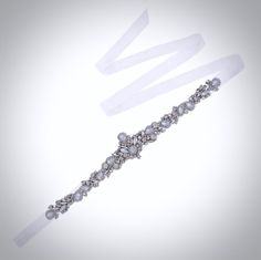 Add a touch of classic elegance to your bridal gown with this sparkling beaded belt! Adorned with an array of glowing Swarovski opals and crystals on a silver base, it will give your dress an extra touch of glam to finish off your perfect look on your wedding day. The crystal appliqué measures approx. 14" (approx. 35.5cm) long by 2" (approx. 5cm) at the widest point. It can be ordered attached to your choice of white organza ribbon, white or ivory double-faced satin ribbon, 0.75" (approx. 2cm) w Bridal Sash Belt, Ribbon White, Beaded Belt, Bridal Belt, Organza Ribbon, Bridal Gown, Classic Elegance, Look On, On Your Wedding Day