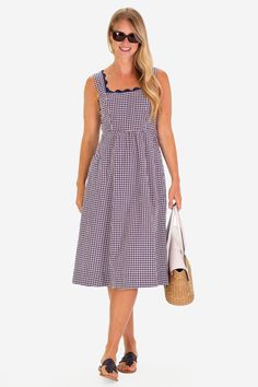 The RicRac Wendy dress is the perfect pop of spring, ready to take you to the farmers market, brunch, and a sunny shopping day FEEL: The classic Navy Gingham is a woven fabric that is breathable yet will withstand many seasons of wear. (50% polyester, 50% cotton) FAVORITE FEATURES: Scallop neckline detail Midi length Thick tank strap-bra friendly! Cotton Lined Midi Dress For Garden Party, Spring Plaid Lined Dress, Cotton Midi Dress With Square Neck For Picnics, Square Neck Cotton Midi Dress For Picnic, Gingham Sundress For Picnic, Gingham Midi Sundress For Picnic, Summer Cotton Midi Dress For Picnic, Summer Square Neck Sundress For Picnic, Cotton Midi Dress For Picnic