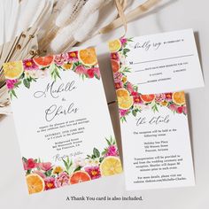 wedding stationery with orange slices and flowers