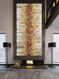 an abstract painting on the wall above a fireplace in a living room with two lamps