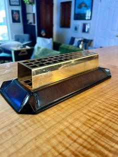 an electronic device sitting on top of a wooden table