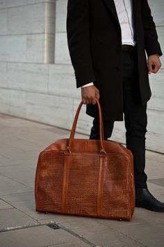 Jet-set in luxury with our Handwoven Leather Duffle Adventure. Elevate your travel experience and make a statement wherever you go. Leather Duffle Bag With Top Carry Handle For Trip, Tote Briefcase With Top Carry Handle For Business Trips, Tote-shaped Briefcase With Top Carry Handle For Business Trips, Business Trips Tote Briefcase With Top Carry Handle, Large Capacity Travel Pouch, Modern Rectangular Cases For On-the-go, Business Trip Briefcase With Top Carry Handle, Leather Travel Accessories With Removable Pouch For Everyday Use, Versatile Leather Satchel Briefcase