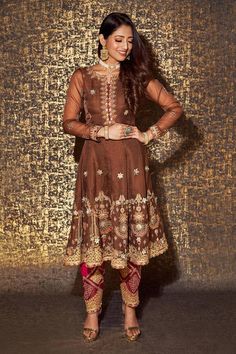 Mocha brown full sleeves anarkali with all over gulshan bagh embroidery using dori, thread and gota highlights. Paired with a magenta pink floral jaal embroidered salwar pant and a bullian leaf scallop border embroidered sunset yellow organza dupatta. - Aza Fashions Designer Long Sleeve Churidar With Dabka Work, Long Sleeve Lehenga With Dabka Work For Eid, Brown Resham Embroidered Sets For Diwali, Long Sleeve Georgette Choli For Eid, Brown Sets With Resham Embroidery For Diwali, Brown Resham Embroidery Sets For Diwali, Brown Sets With Resham Embroidery And Long Sleeves, Festive Brown Party Sets, Brown Long Sleeve Sets With Resham Embroidery