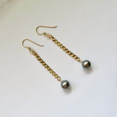 "Tahitian Pearl Earrings~ These elegant earrings have genuine pastel Tahitian pearls on 14k gold fill cuban chain. This listing is for the earrings in the first photos Pearls approx. 9mm. Dangles approx. 2\" from bottom of earwire Tahitian pearl jewelry~ https://www.etsy.com/shop/HanaMauiCreations?ref=hdr_shop_menu&section_id=7842721 Shop~ http://www.etsy.com/shop/HanaMauiCreations?ref=pr_shop_more International buyers please read our shipping policies before ordering~ POLICIES~ https://www.etsy Gold Akoya Pearl Chain Earrings, Dangle Pearl Earrings With Pearl Chain, Gold Dangle Pearl Earrings With High Luster, Gold High Luster Dangle Pearl Earrings, Tahitian Pearl Jewelry With Matching Earrings For Anniversary, Gold Tahitian Pearl Earrings For Anniversary, High Luster Gold Dangle Pearl Earrings, Formal Tahitian Pearl Jewelry With Matching Earrings, Tahitian Pearl Dangle Earrings Gift