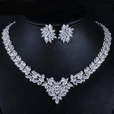 Not available in stores. Diamonds may be a girl's best friend, but this Bridal Necklace & Earrings Cubic Zirconia Jewelry Set is a super gorgeous copy is hard to resist. There's no need to spend a fortune on statement jewelry when 3DVanity brings you beautiful, unique quality bridal or formal jewelry. You'll feel like the rich and famous or royalty as people stare at them wondering if they are the real thing. Why? Because Cubic Zirconia look and sparkle like real diamonds! And lucky you at a fraction of the price. Say yes to this beautiful crafted Choker Necklace and Earring set. They make an impressive gift for that special someone in your life. Here are the qualities of this dazzling Bridal Necklace & Earrings Cubic Zirconia Jewelry Set: * Elegantly Designed with Marquis Diamond Cut Cubi African Wedding Jewelry, Jewelry White Gold, Formal Jewelry, Bridal Jewelry Set, Zirconia Necklace, Earring Sets, Cubic Zirconia Necklace, Wedding Party Gift, Jewelry White