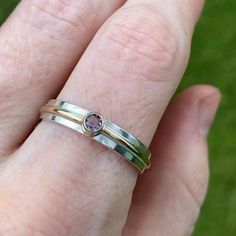 Very simple, clean and classy ring made from sterling silver, 14k gold, and an Alexandrite birthstone. Fabricated by hand, a ring shank is formed out of sterling silver rectangle wire by hammering and soldering. The artist's stamp is placed on the inside of the shank. A piece of 14 karat gold tubing is soldered to the shank along with a piece of 14 karat gold wire that is wraped around the shank. The fine silver is brought to the surface to remove firescale and prevent tarnishing. A 3mm Alexandr Modern Amethyst Birthstone Ring For Anniversary, Alexandrite Birthstone, Classy Ring, Ring Shank, Stone Wrapping, Wrap Ring, Wrap Rings, Gold Wire, Soldering