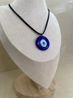 Made from quality glass and string. This evil eye necklace is said to repel negative energy such as jealousy, hatred, anger and fear, . The evil eye 'stare' is believed to bring bad luck to the person providing the negative energy or bad luck. This is a traditional belief that is meant to protect you from evil spirits. Provides a symbol of protection. Can be used for any event to bring good luck. The evil eye necklace is modern yet traditional in its belief. It makes a perfect gift to anyone. Symbole Protection, Glass Evil Eye, Turkish Eye, Necklace Cord, Black Rope, Bad Luck, Evil Spirits, Evil Eye Necklace, Cord Necklace