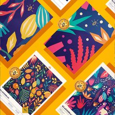 an assortment of colorful papers with designs on them