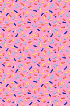 colorful sprinkles on a pink background