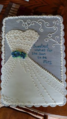 a wedding dress cake on top of a table