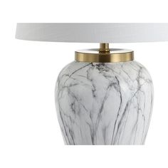 a white marble lamp with a gold metal base