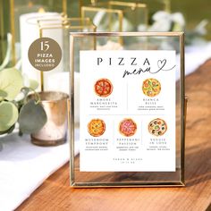 pizza menu displayed on wooden table with greenery and candles in the background for wedding reception