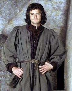 the young man is dressed in medieval clothing