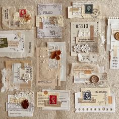 many different pieces of paper and buttons on a table