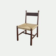 a wooden chair with a woven seat pad on the back of it, against a white background