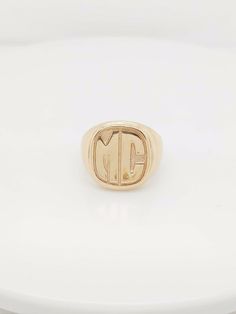 "Here we have a beautiful 14k yellow gold mc initial ring. Weigth: 16.9g. Width: 0.60\". In excellent condition. The perfect gift for your loved one. Comes with a free gift box." Classic Formal Initial Ring With Hallmarks, Luxury Formal Initial Ring With Hallmarks, Luxury Hallmarked Initial Ring For Formal Occasions, Classic Gold Initial Ring With Hallmarks, Modern Hallmarked Initial Ring For Formal Occasions, Luxury Yellow Gold Initial Ring For Formal Occasions, Modern Yellow Gold Initial Ring With Monogram, Luxury 14k Gold Initial Ring, Modern Signet Ring With Initials For Formal Occasions