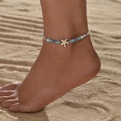 Step into the enchanting realm of summer with our Ocean Style Blue Beads Mixed Starfish Ladies Anklet, a mesmerizing piece of foot jewelry that captures the essence of the sea. Crafted with meticulous attention to detail, this anklet exudes coastal elegance with its delicate blue beads interspersed with whimsical starfish motifs. Each bead whispers of ocean waves, while the starfish adds a touch of playful charm, reminiscent of lazy days spent by the shore. Whether you're wandering along sandy b Starfish-shaped Beaded Beach Jewelry, Blue Starfish Charm Anklet For Vacation, Blue Anklet With Starfish Charm For Vacation, Blue Anklets With Starfish Charm For Gift, Blue Anklets With Starfish Charm As Gift, Ocean-inspired Strand Anklets As A Gift, Ocean-inspired Summer Beach Anklets, Gold Starfish Beaded Bracelets For Beach, Blue Starfish Charm Anklet For Summer