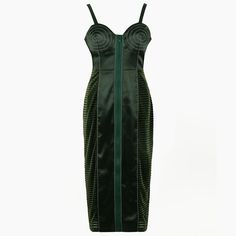 a green dress with an open back and zippers on the sides, in front of a white background