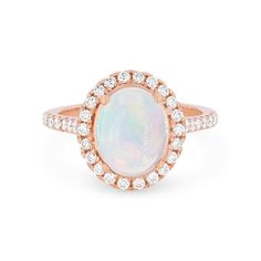 Timeless and romantic, this ring features a 1.70 carat oval cut opal accented by a halo of round brilliant cut diamonds totaling 0.60 carats. Oval Moonstone Ring With Diamond Halo Setting, Luxury Oval Opal Ring With Halo Setting, Opal Rings With Diamond Accents, Oval Shaped, Formal Oval Moonstone Ring With Halo Setting, Oval Opal Rings With Diamond Accents, Classic Opal Ring With Diamond Accents, Classic Oval Opal Ring With Diamond Accents, Oval Opal Ring With Diamond Center Stone, Oval Diamond Opal Ring With Center Stone