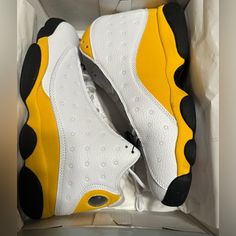 The Air Jordan 13 Retro Del Sol Is A Colorway Of The Iconic Air Jordan 13 Worn By Mj Throughout Most Of The 1998 Postseason. This Sneaker Is Dressed In A White, Del Sol, University Red, And Black Color Scheme. The Hits Of Yellow Are On The Suede Overlays, While Hits Of White Are Visible On The Shoe’s Panels, Toe, And Tongues. The Red Is On The Jumpman Logo Embroidered On The Tongue, While The Black Is Visible On The Shoe’s Rubber Outsole. . Yellow Synthetic Basketball Shoes With Boost Midsole, Yellow Synthetic Jordan Sport Shoes, Yellow Synthetic Jordan Sporty Shoes, Yellow Synthetic Jordan Shoes For Streetwear, Yellow Sporty Jordan Shoes In Synthetic Material, Yellow Synthetic Jordan Shoes, Yellow Sporty Jordan Shoes, Yellow High-top Synthetic Jordan Shoes, Yellow Low-top Synthetic Jordan Shoes