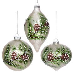 three glass christmas ornaments with pine cones on them