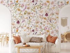 a living room with flowers painted on the wall