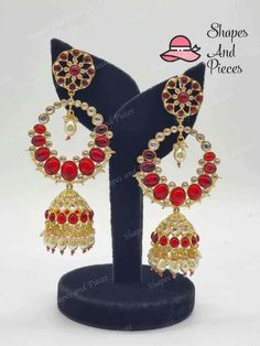 Fall in love with the Aleena Jhumka and its beautiful tyani kundan design! These earrings add a classic touch to any outfit and will surely be a timeless addition to your jewelry collection. Adorn yourself with stunning grace and elegance. LENGTH : 4 inches approx Temple Jewelry Danglers For Diwali Weddings, Diwali Wedding Temple Jewelry Danglers, Chandbali Jhumkas For Wedding And Navratri, Wedding Chandbali Jhumkas For Navratri, Temple Jewelry Stone Work Danglers For Wedding, Temple Jewelry Style Bridal Earrings With Stone Work, Traditional Festive Hand Set Chandbalis, Traditional Festive Chandbalis With Hand Set Details, Temple Style Bridal Earrings With Stone Work