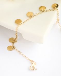 The bracelet is all 14 carat gold with the chain. As standard, the color of the bracelet and pendant is gold, if you specify it in your order, we can make it in any color (gold rose silver). All our jewelry is made of pure 14 carat gold and is never plated. Because our jewelry is gold, it never tarnishes. We also send polished wipes along with our products. The polished cloth is useful for polishing the jewelry and removing the stains on it. It is a jewelry that adults and young people can wear Handmade 14k Gold Dainty Bracelet, Handmade Dainty 14k Gold Bracelet, 14k Gold Bracelet With Adjustable Chain For Wedding, 14k Gold Wedding Bracelet With Adjustable Chain, Handmade Gold Charm Bracelet For Wedding, Handmade 14k Gold Bracelet As Gift, Handmade 14k Yellow Gold Bracelet, Elegant Jewelry With Charms For Celebration, Handmade Yellow Gold Charm Bracelet