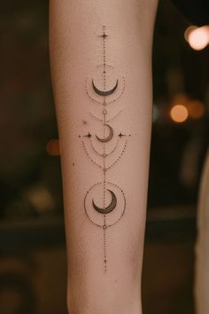 a woman's leg with an intricate tattoo design on the lower half of her arm