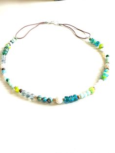 This beautiful summer gemstone and crystal necklace was inspired by the colors of the sea on a trip to the beach. It captures the colors of sand, water, shells, and sea life. Take a little bit of the sea with you wherever you go. Makes a lovely gift for beach lovers! Length:  Approximately 20 inches Comes ready to give as a gift.  ** Not for children. Beach Lovers, Beautiful Summer, Sea Life, Under The Sea, Bronx, Lovely Gift, Crystal Necklace, The Sea, The Beach