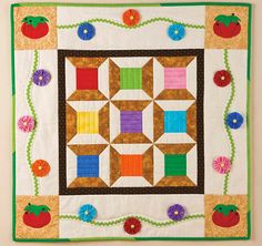 a quilted wall hanging in the kitchen